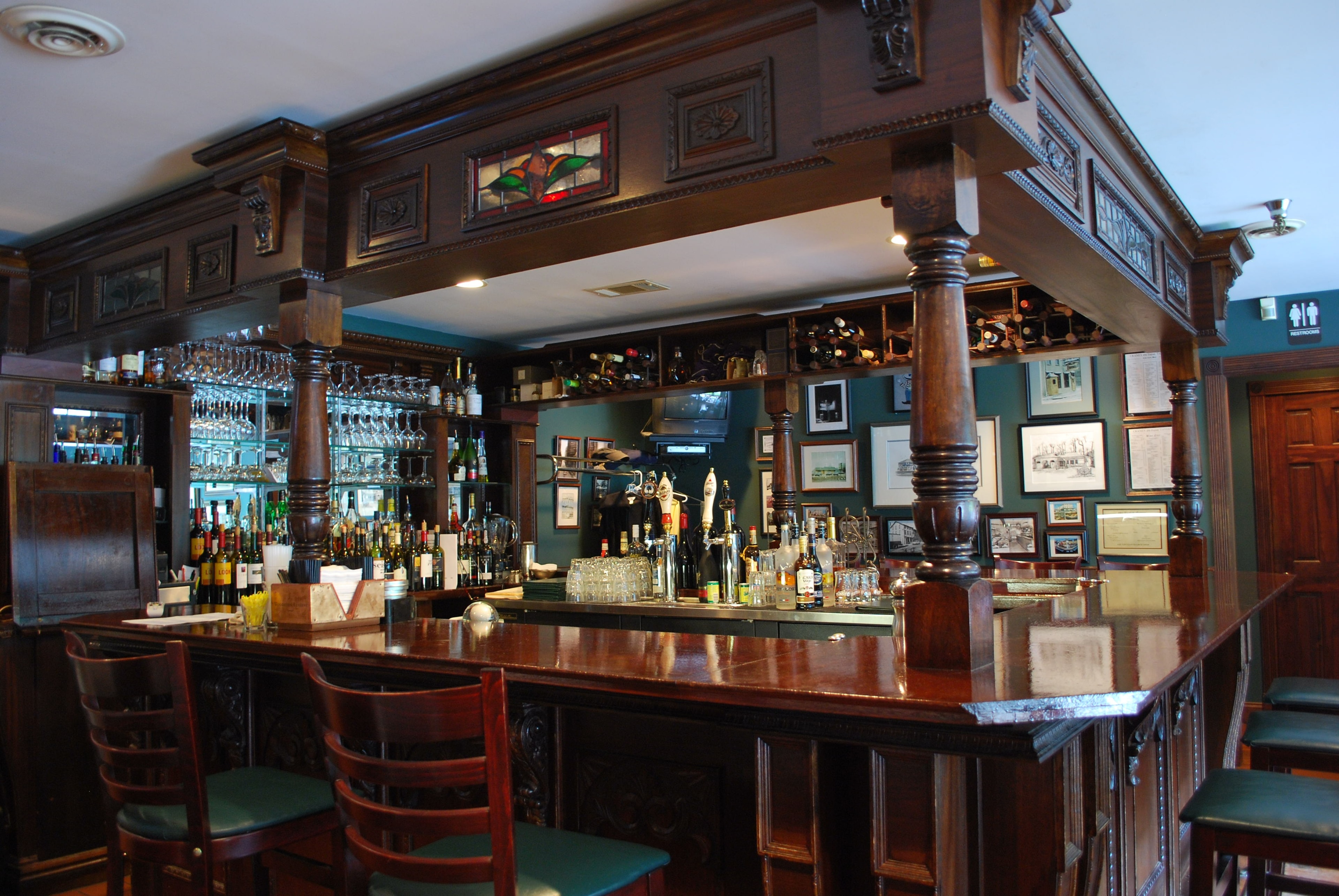 Classic dark wood bar interior at Crane's Tavern